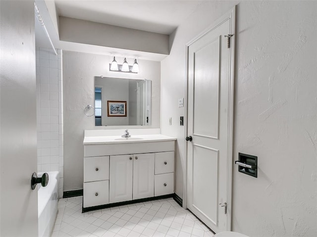 bathroom featuring tile patterned floors, tub / shower combination, and vanity