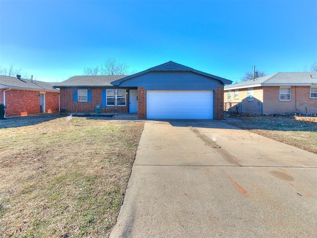 ranch-style home with a garage and a front lawn