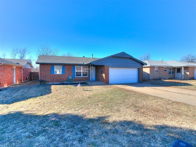 ranch-style home with a garage and a front lawn