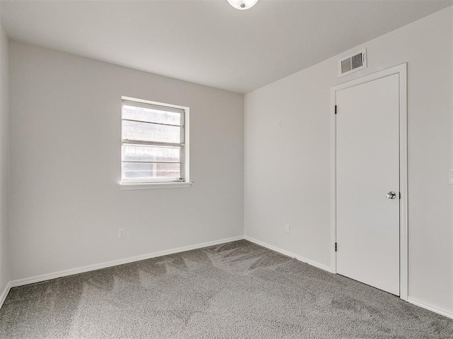 empty room with carpet flooring