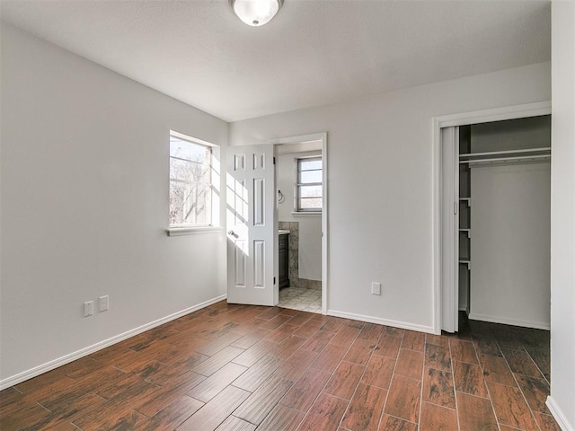 unfurnished bedroom with a closet