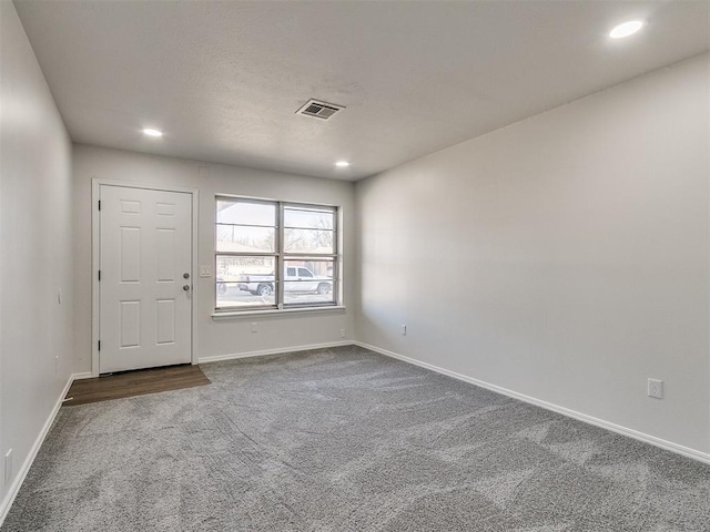 empty room with carpet flooring