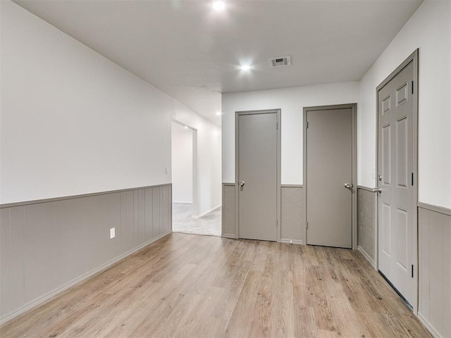 empty room with light hardwood / wood-style floors