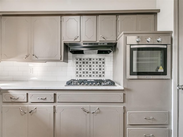 kitchen featuring backsplash and stainless steel appliances