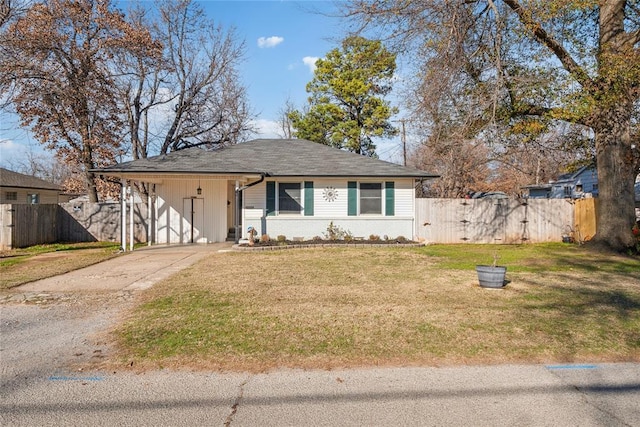 view of front facade featuring a front lawn and a carport