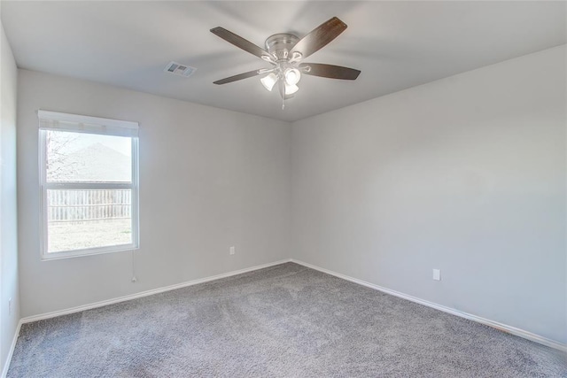 unfurnished room with carpet flooring and ceiling fan