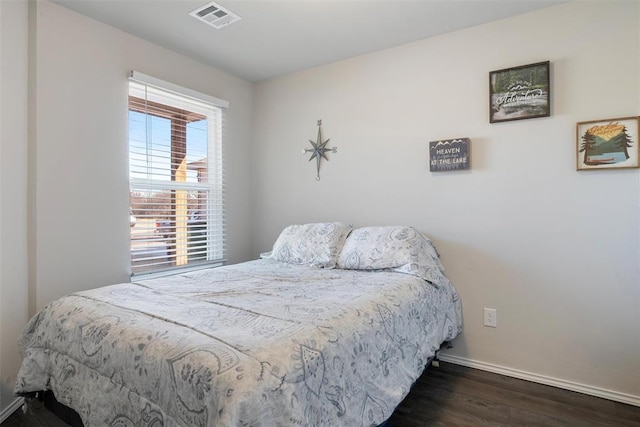 bedroom featuring dark wood-type flooring