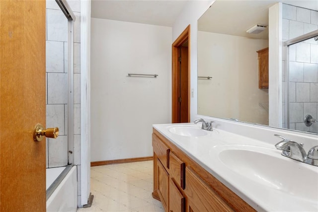 bathroom featuring vanity and enclosed tub / shower combo