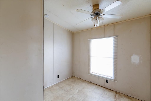 empty room featuring ceiling fan