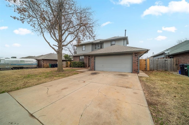 view of front facade with a garage and a front lawn