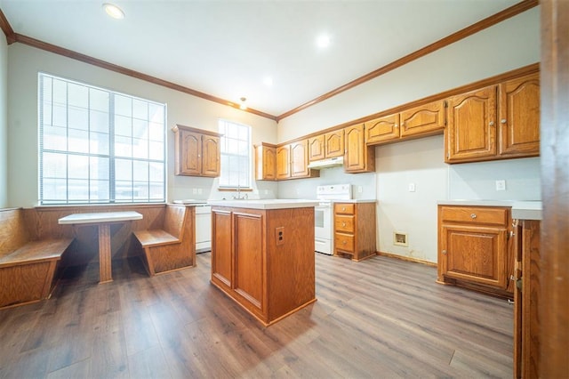 kitchen featuring crown molding, a center island, dark hardwood / wood-style floors, and white appliances