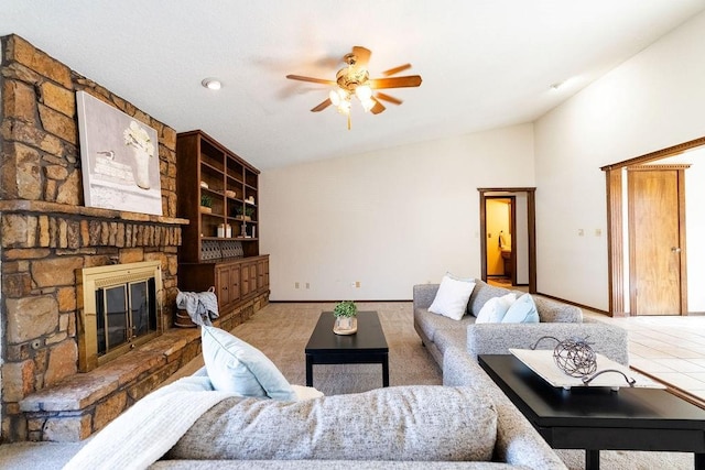 living room featuring built in shelves, ceiling fan, a stone fireplace, and lofted ceiling