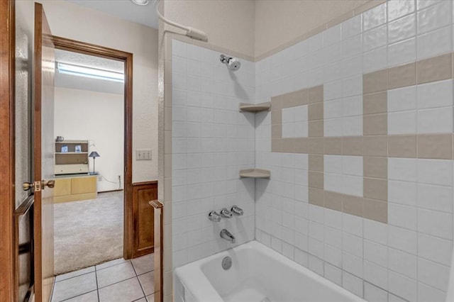 bathroom with tile patterned flooring and tiled shower / bath combo