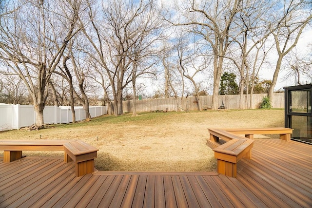 wooden deck with a lawn