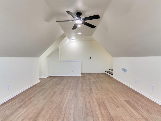 bonus room with light hardwood / wood-style floors, ceiling fan, and lofted ceiling