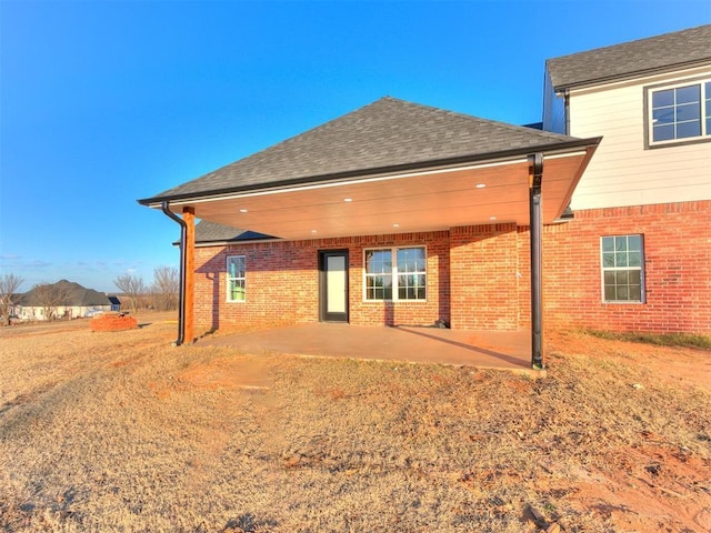 back of property featuring a patio