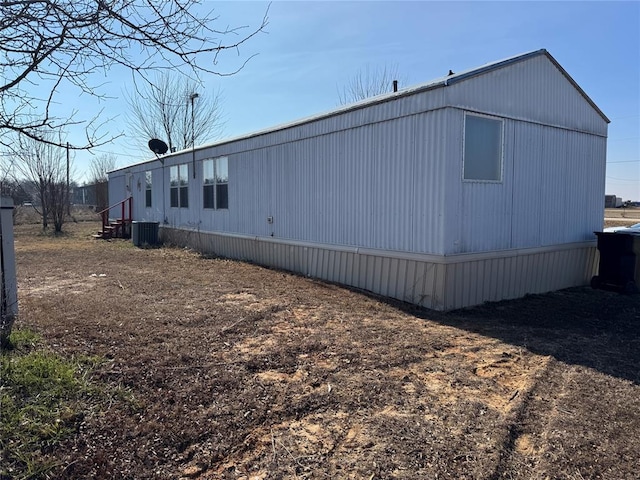 view of side of property with central AC