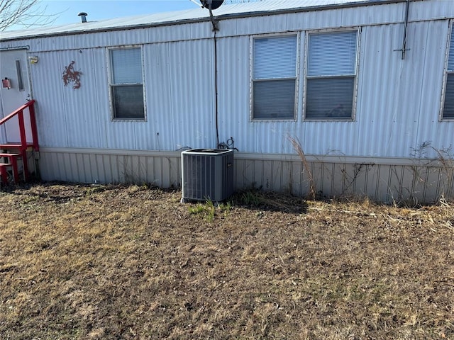 view of property exterior with cooling unit