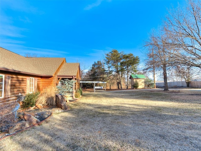 view of yard with a carport