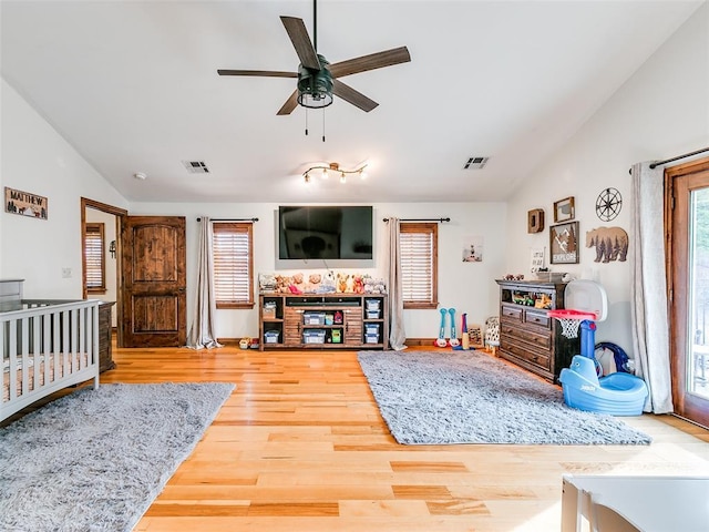 bedroom featuring lofted ceiling, ceiling fan, and wood-type flooring