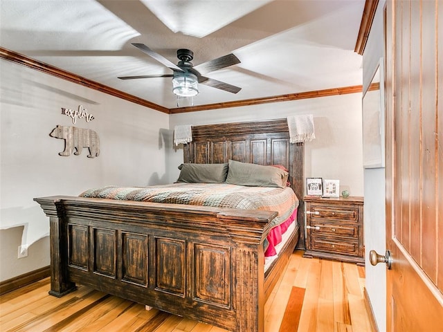 bedroom featuring ceiling fan, light hardwood / wood-style flooring, and crown molding