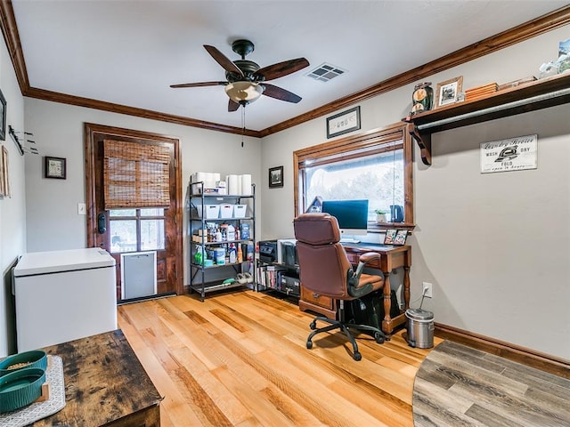 office space featuring hardwood / wood-style floors, plenty of natural light, ceiling fan, and ornamental molding