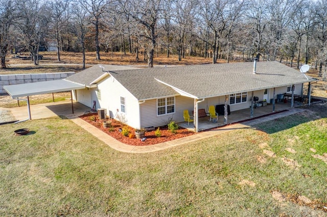 exterior space featuring a lawn, central AC, and a patio