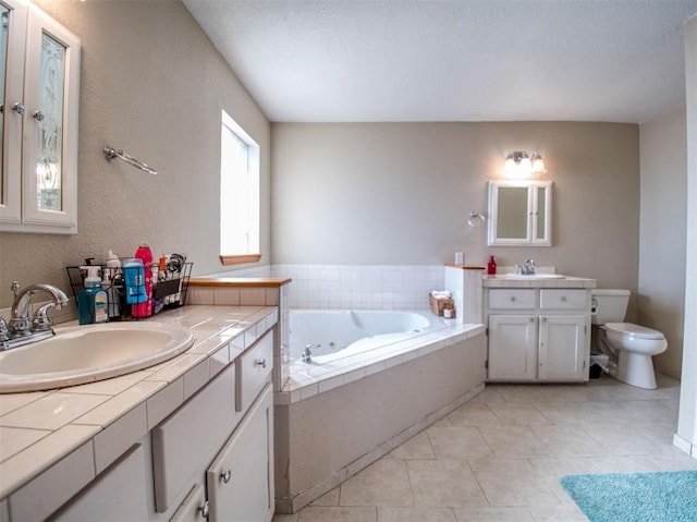 bathroom featuring a tub to relax in, tile patterned flooring, vanity, and toilet