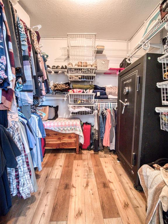 spacious closet featuring light wood-type flooring