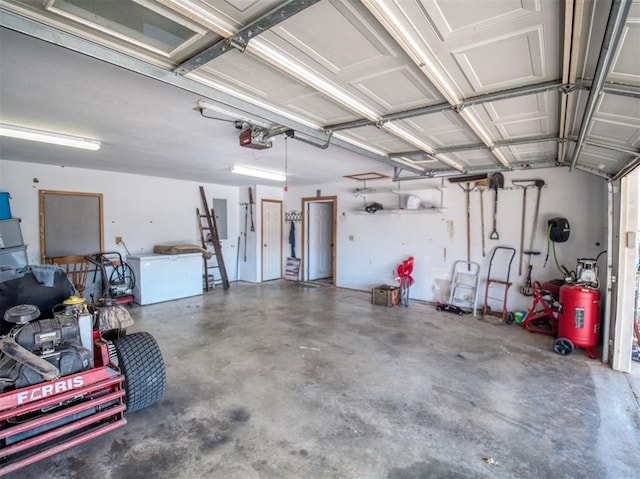 garage featuring electric panel and a garage door opener