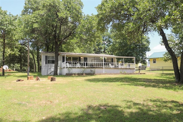 view of front of home featuring covered porch and a front yard