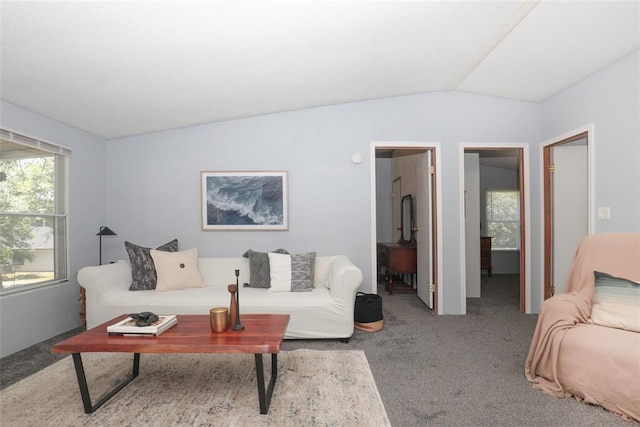 living room featuring light carpet and lofted ceiling