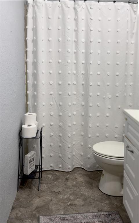 bathroom with vanity and toilet