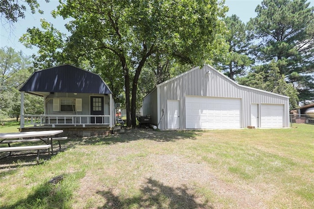 exterior space featuring a lawn and a porch