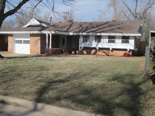 ranch-style house with a garage and a front lawn