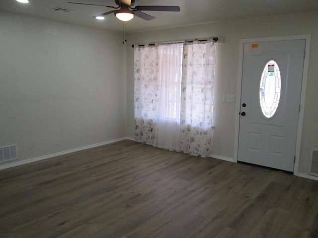 entrance foyer featuring baseboards, visible vents, ceiling fan, and wood finished floors