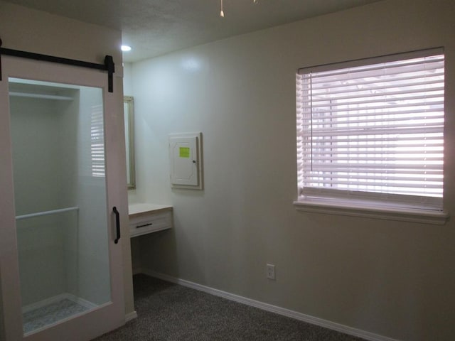 full bathroom with electric panel, baseboards, vanity, a shower stall, and recessed lighting