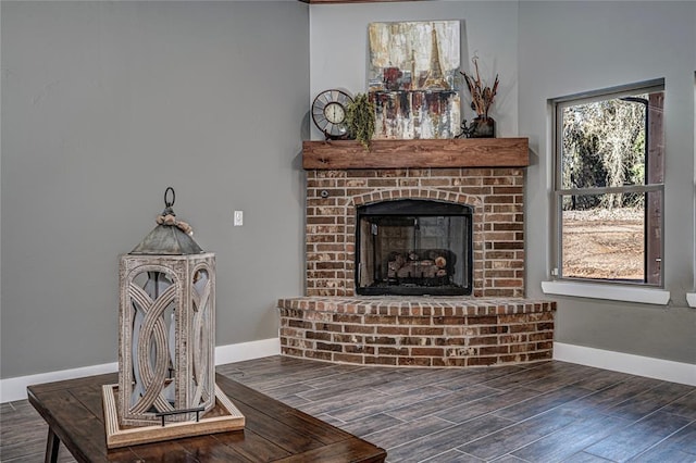 living room featuring a brick fireplace