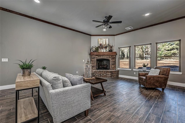 living room with ceiling fan and a fireplace