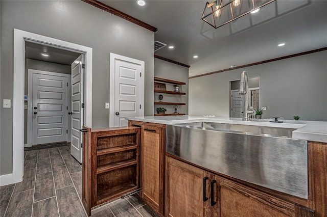 kitchen with sink and ornamental molding