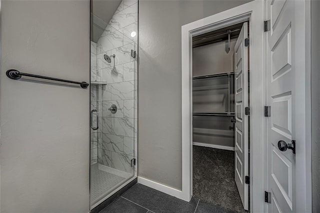 bathroom with tile patterned floors and an enclosed shower