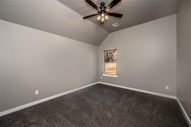 empty room featuring carpet flooring, ceiling fan, and lofted ceiling