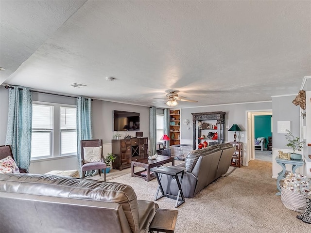 living room featuring a textured ceiling, light colored carpet, and ceiling fan