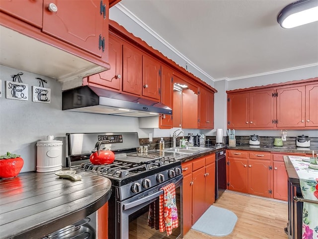 kitchen with stainless steel gas range oven, sink, light hardwood / wood-style floors, and ornamental molding