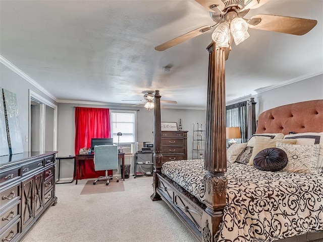 carpeted bedroom with ceiling fan and ornamental molding