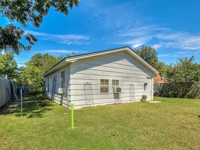 view of side of home with cooling unit and a lawn