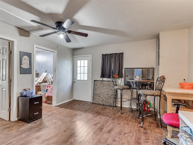 office space featuring ceiling fan and wood-type flooring