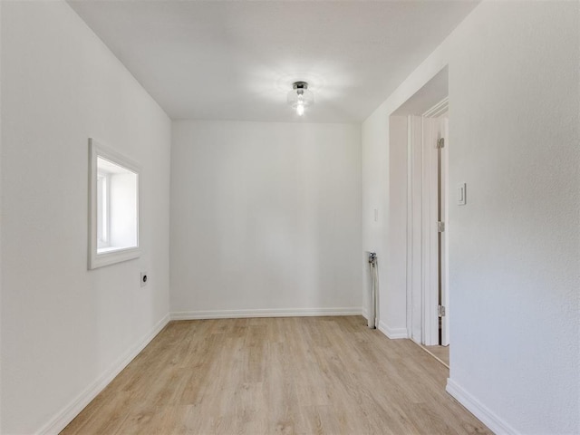 spare room featuring light wood-type flooring