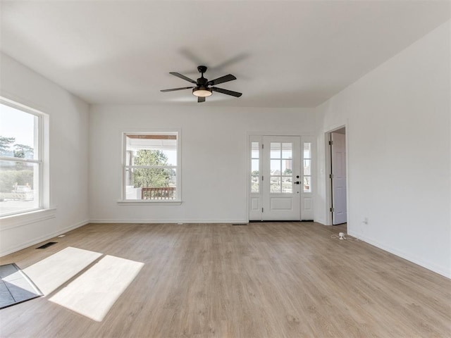 interior space featuring light hardwood / wood-style flooring and ceiling fan