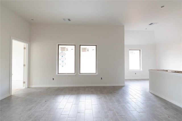 1921 Taines Turn, Norman, OK 73072 - spare room with light wood-style flooring and baseboards